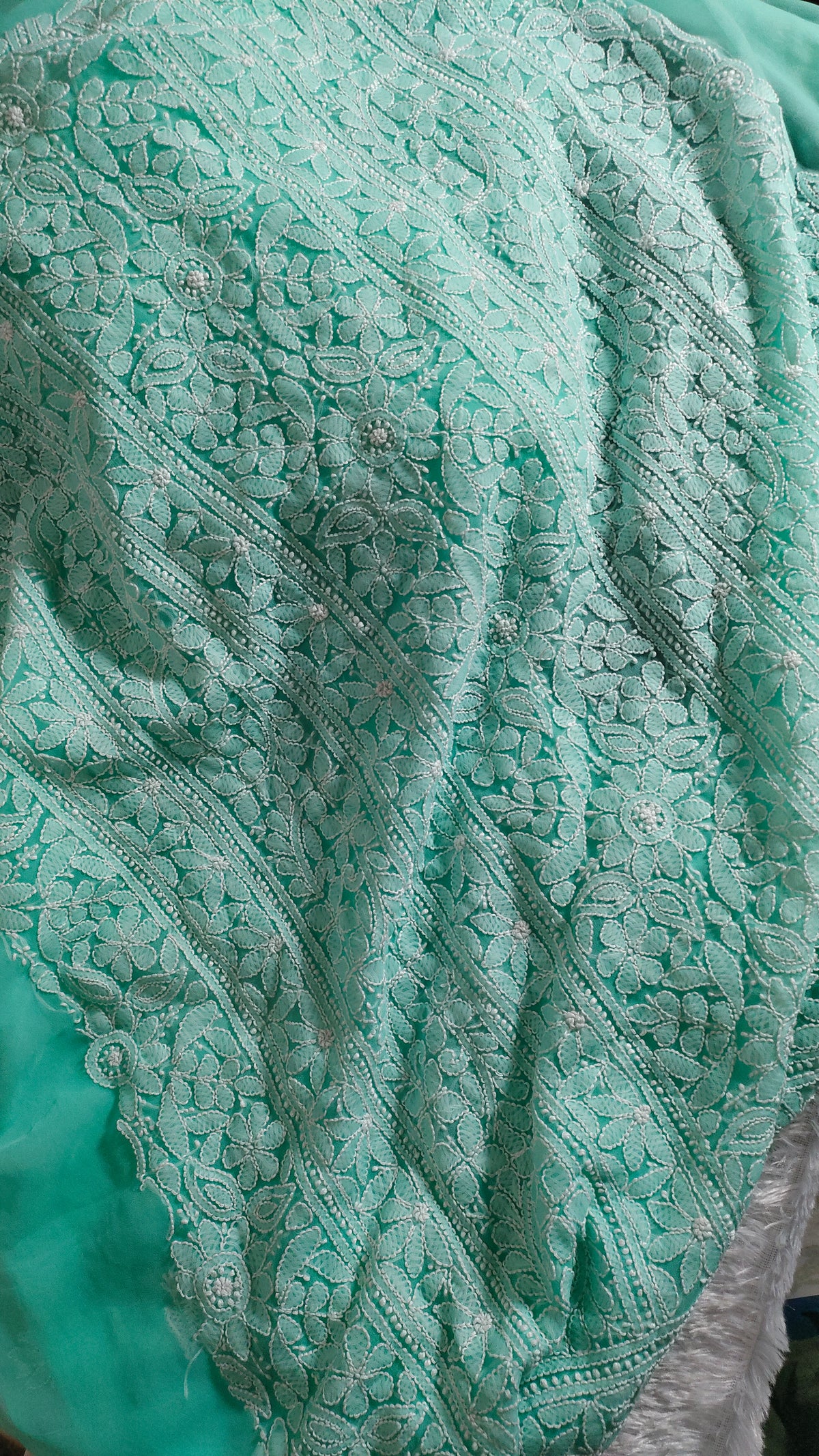 Beautiful handcrafted pink faux georgette Chikankari full suit by LVW Fashions with intricate Lucknow embroidery.