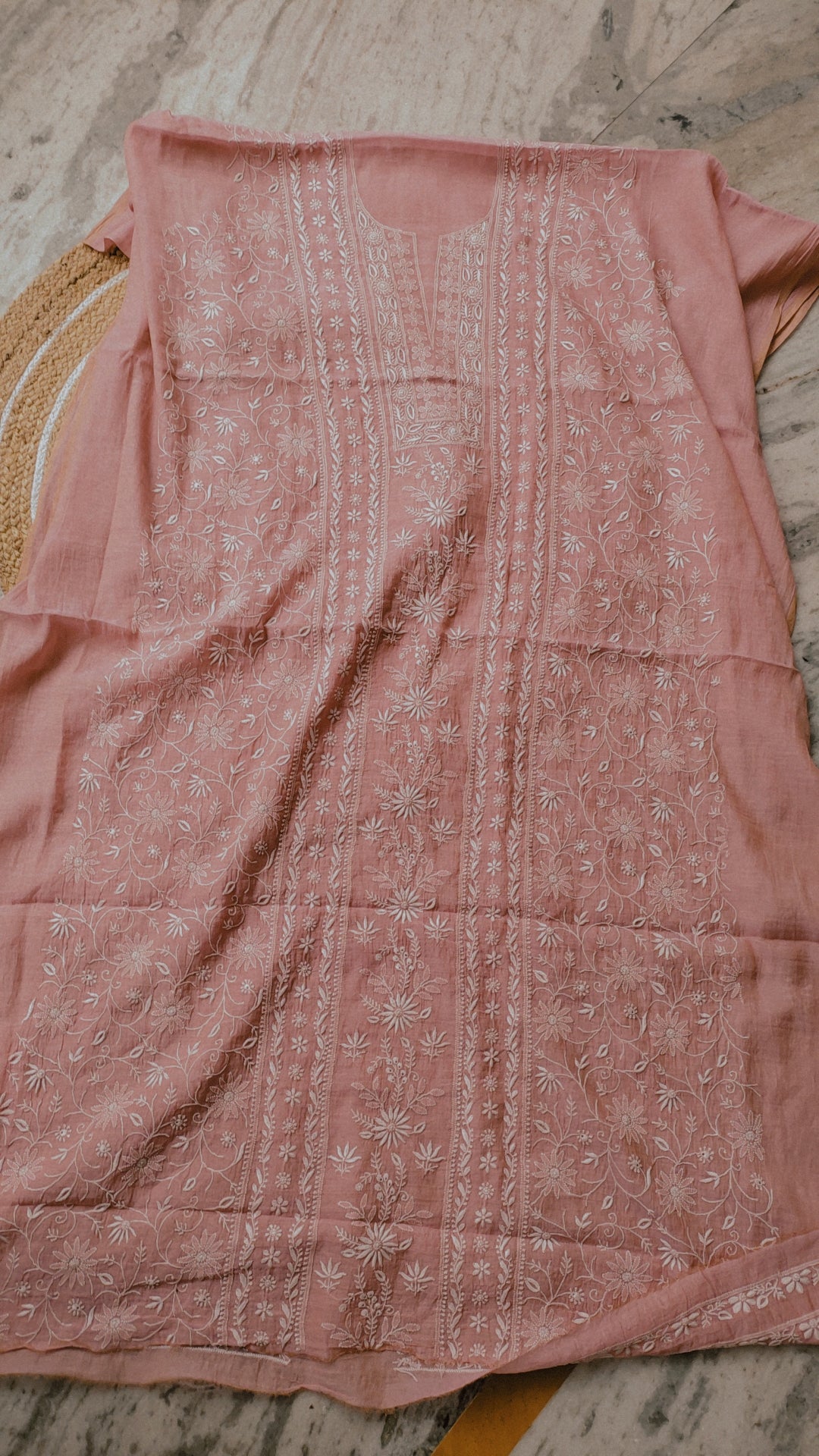 Handmade Lucknow Chikankari Kurta by LVW Fashions featuring intricate white embroidery on soft fabric.