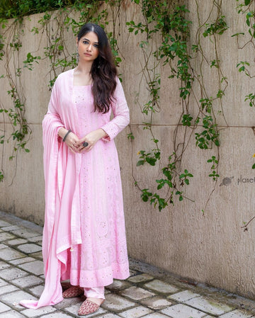 Luxurious pinkish Chikankari Anarkali suit with hand embroidery and dupatta, semi-stitched by LVW Fashions, featuring all-over Kamdani details.