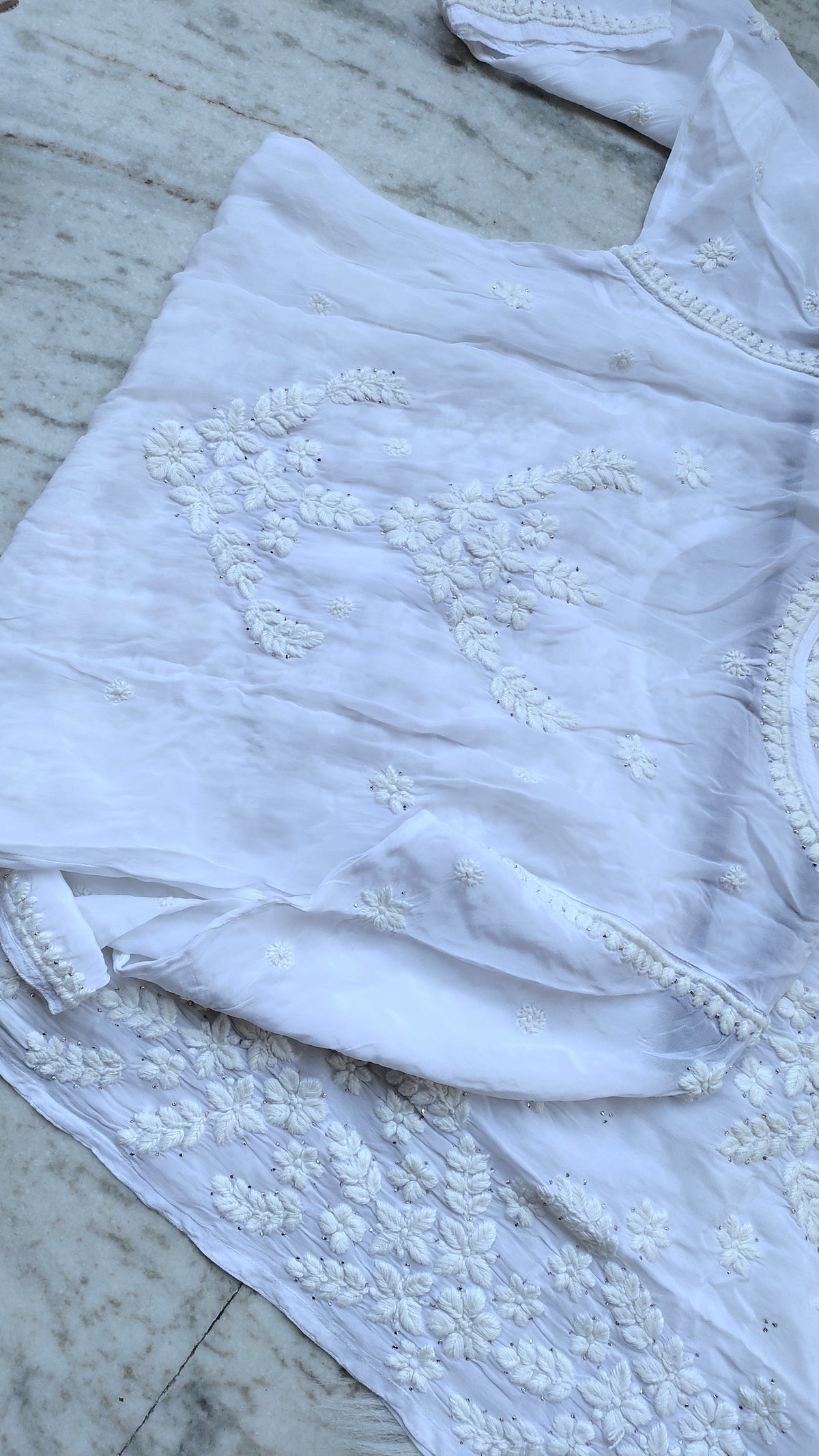 Handmade LVW Fashions Chikankari Kurta with intricate Lucknow embroidery, showcasing detailed white thread work and traditional craftsmanship.