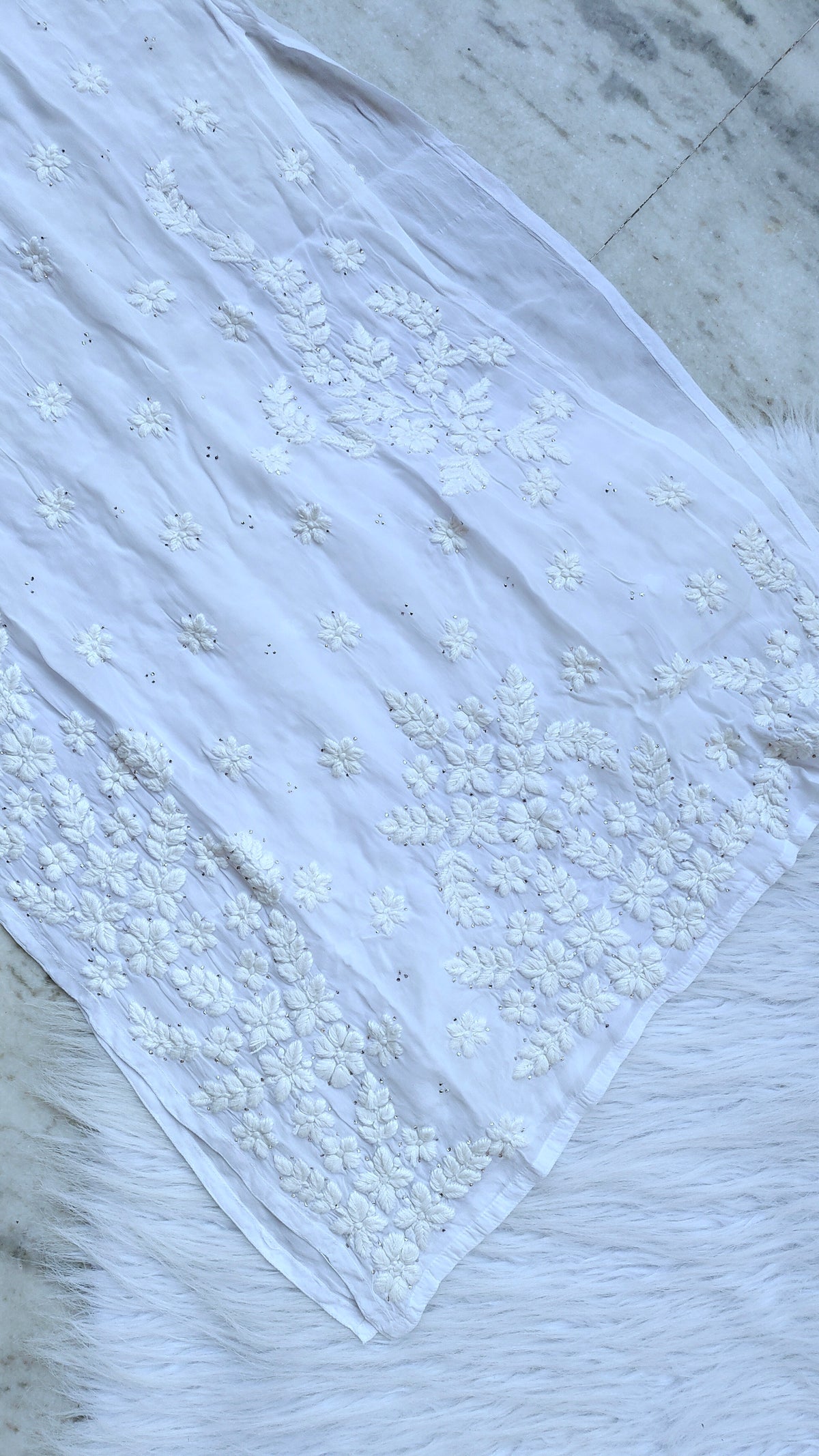 Handmade LVW Fashions Chikankari Kurta with intricate Lucknow embroidery, showcasing detailed white thread work and traditional craftsmanship.
