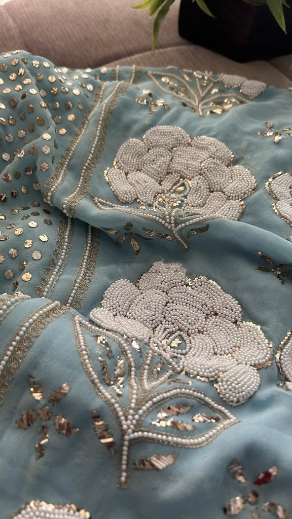 Ivory handmade Georgette Chikankari unstitched suit with pitta Kamdani and pearl embroidery, crafted by LVW Fashions from Lucknow Chikankari.