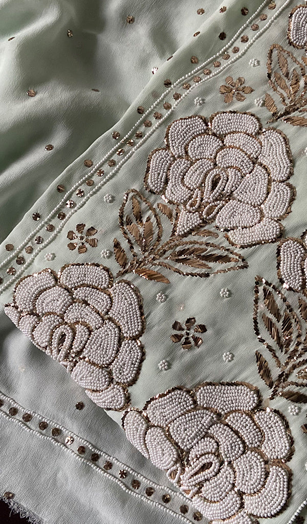 Red premium georgette unstitched suit with Lucknow chikankari, pitta kamdani, and pearl embroidery by LVW Fashions.