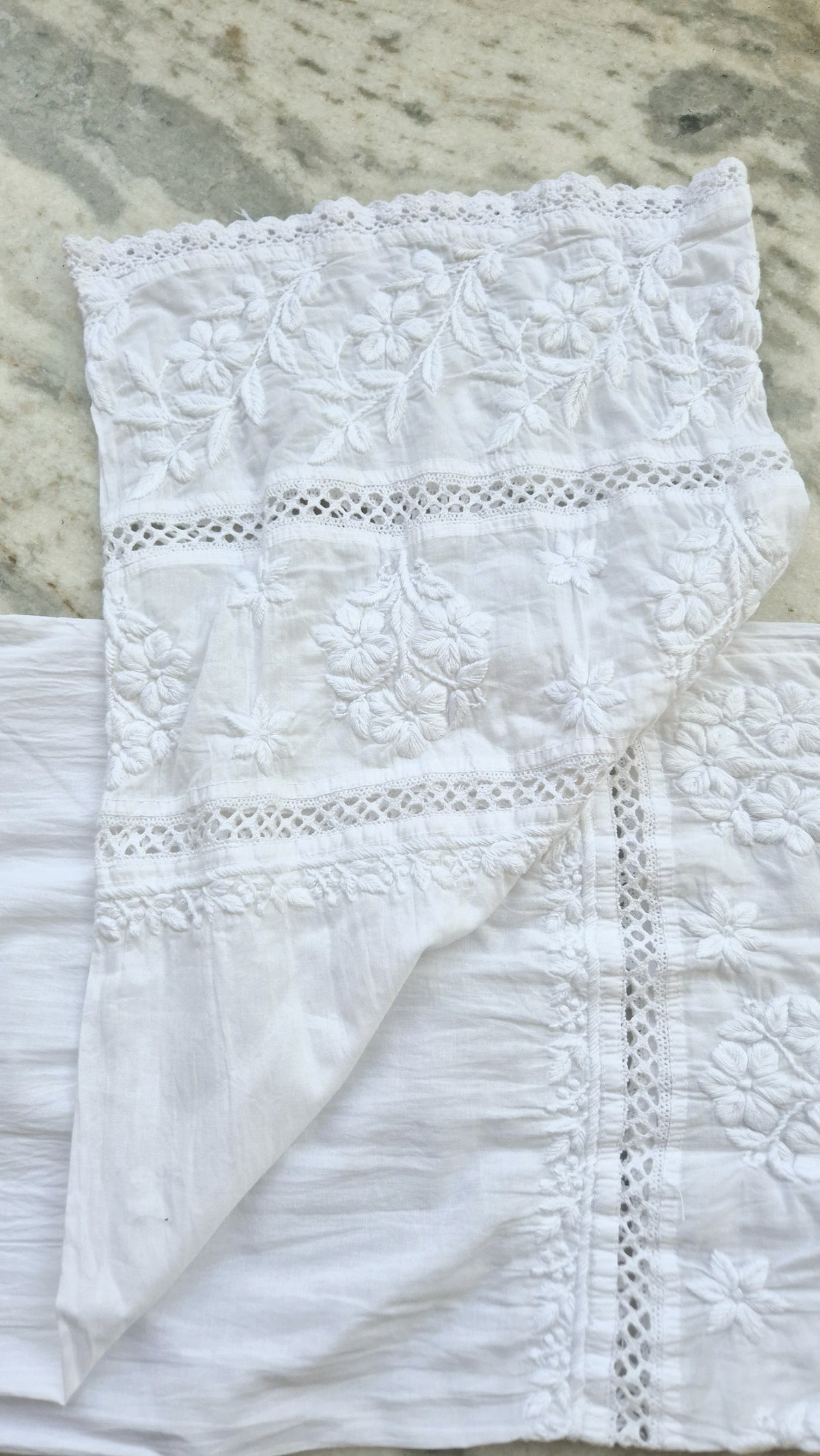 Handmade chikankari kurta with lace, paired with premium soft cotton and silk bottoms, showcasing traditional Lucknow embroidery.