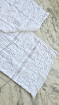 Handmade chikankari kurta with lace, paired with premium pure soft cotton and silk bottoms, crafted by LVW Fashions.