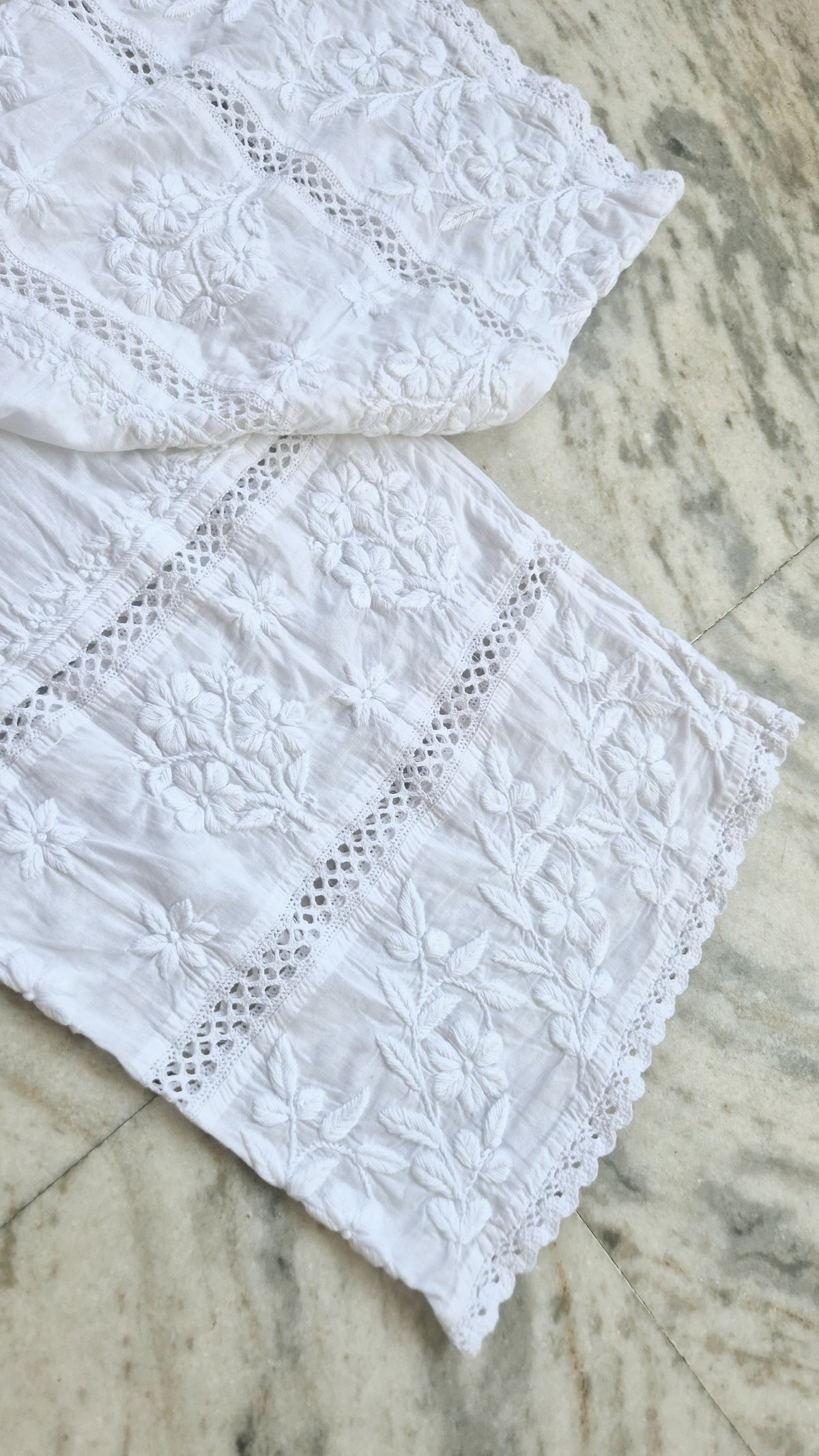 Handmade chikankari kurta with lace, paired with premium pure soft cotton and silk bottoms, crafted by LVW Fashions.