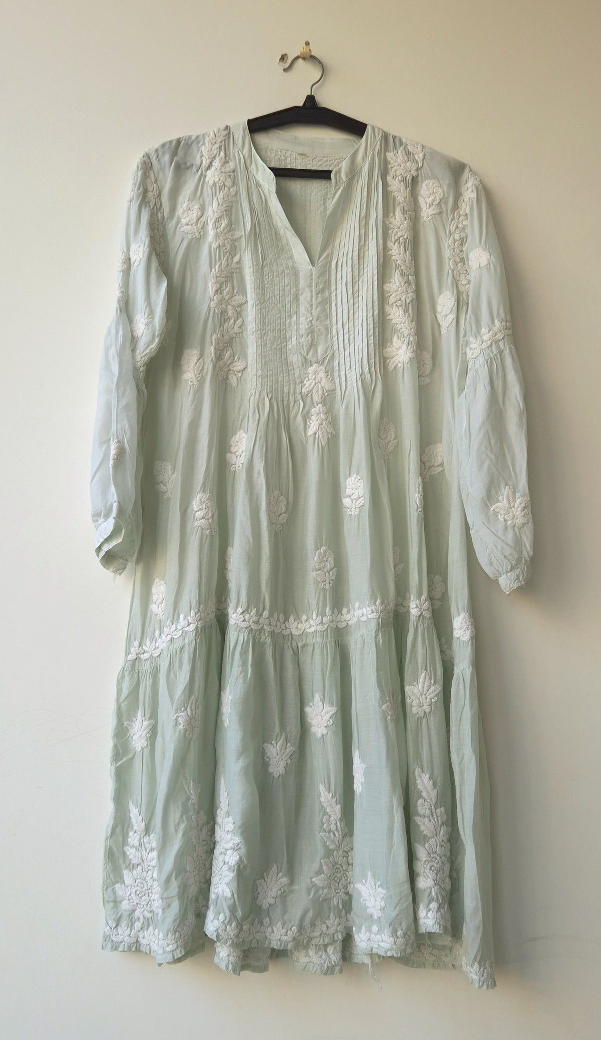 Beautiful pastel-colored handcrafted Chikankari kurta by LVW Fashions featuring intricate Lucknow embroidery and a midi length.