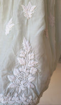 Beautiful pastel-colored handcrafted Chikankari kurta by LVW Fashions, featuring intricate Lucknow-style embroidery.