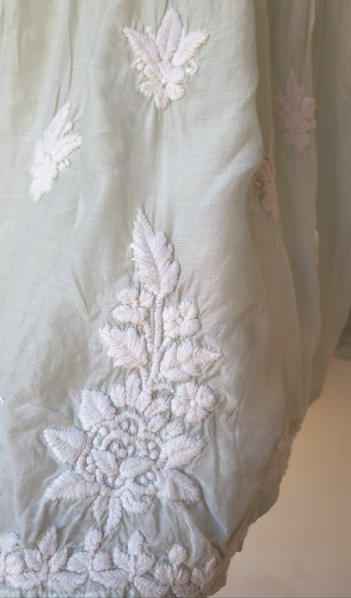 Beautiful pastel-colored handcrafted Chikankari kurta by LVW Fashions, featuring intricate Lucknow-style embroidery.