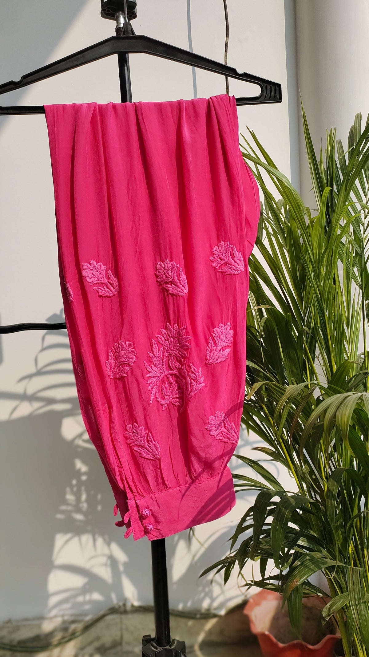 Hot pink georgette Afgani set with dupatta and handmade Lucknow Chikankari kurta by LVW Fashions.