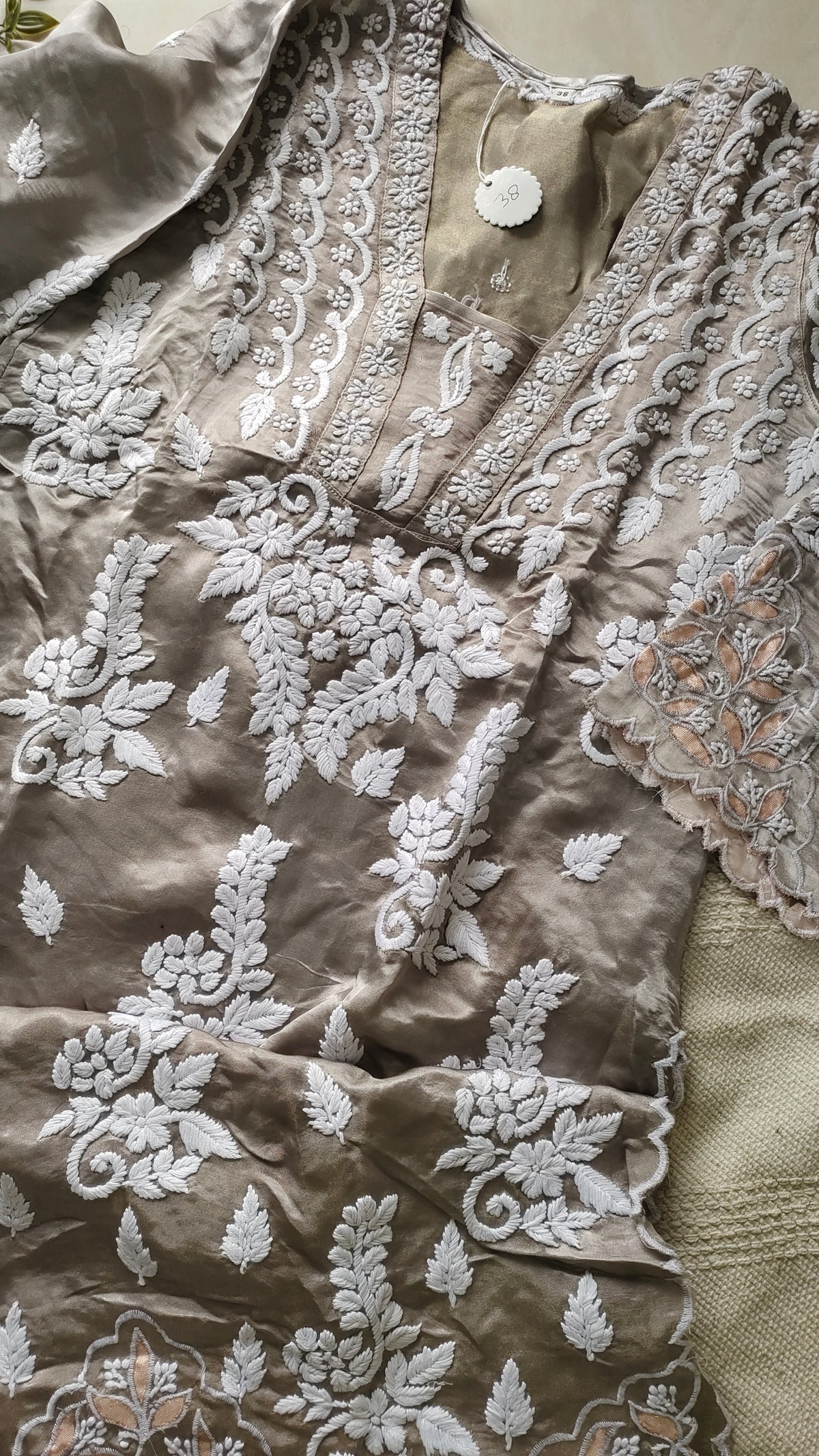 Huma Silver Silk handcrafted designer co-ord set with Lucknow Chikankari and golden Gota work, featuring a matching kurta and pants.