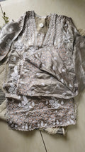 Silver silk handcrafted co-ord set with intricate Lucknow Chikankari and golden Gota work by LVW Fashions.