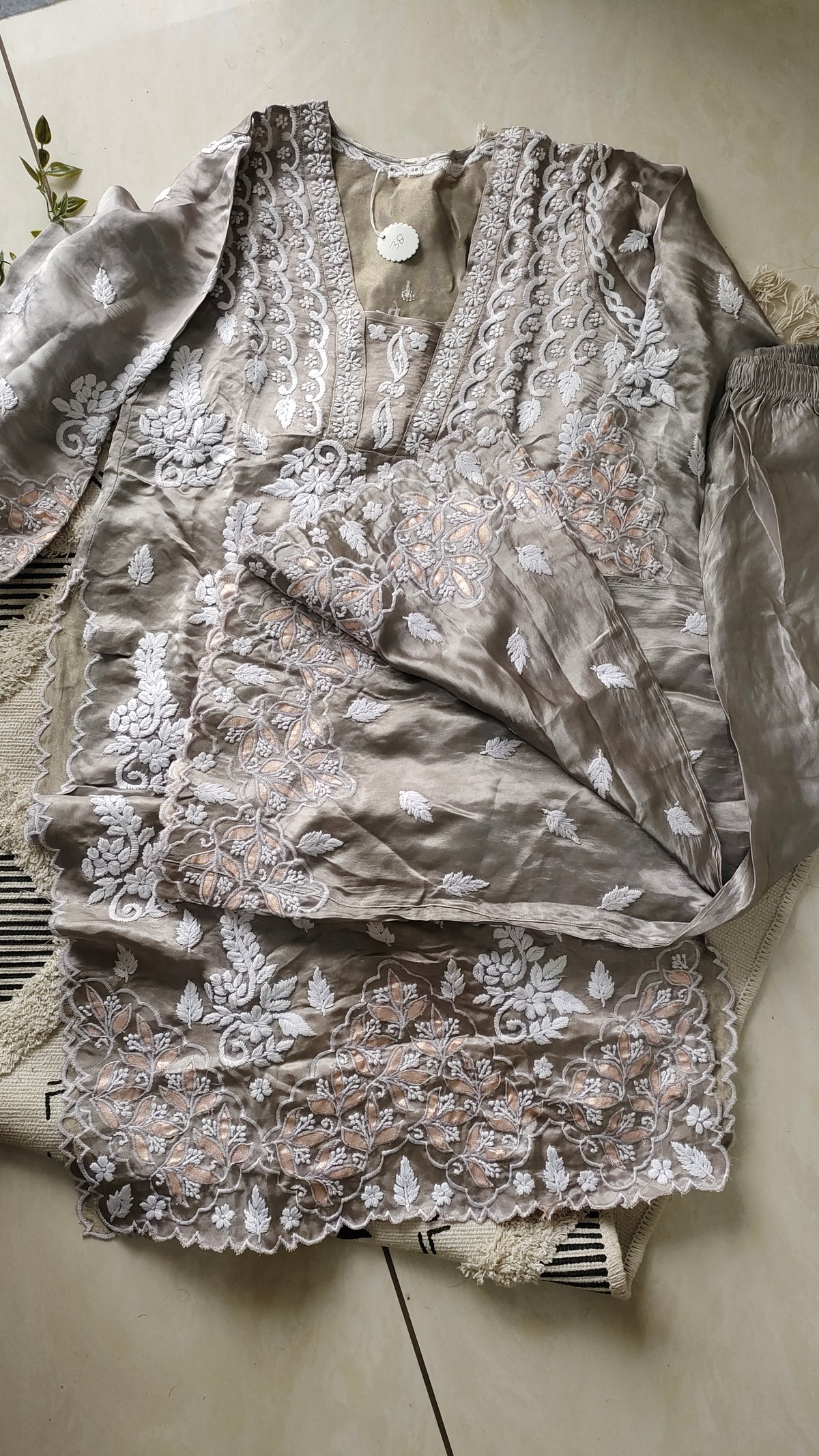 Silver silk handcrafted co-ord set with intricate Lucknow Chikankari and golden Gota work by LVW Fashions.