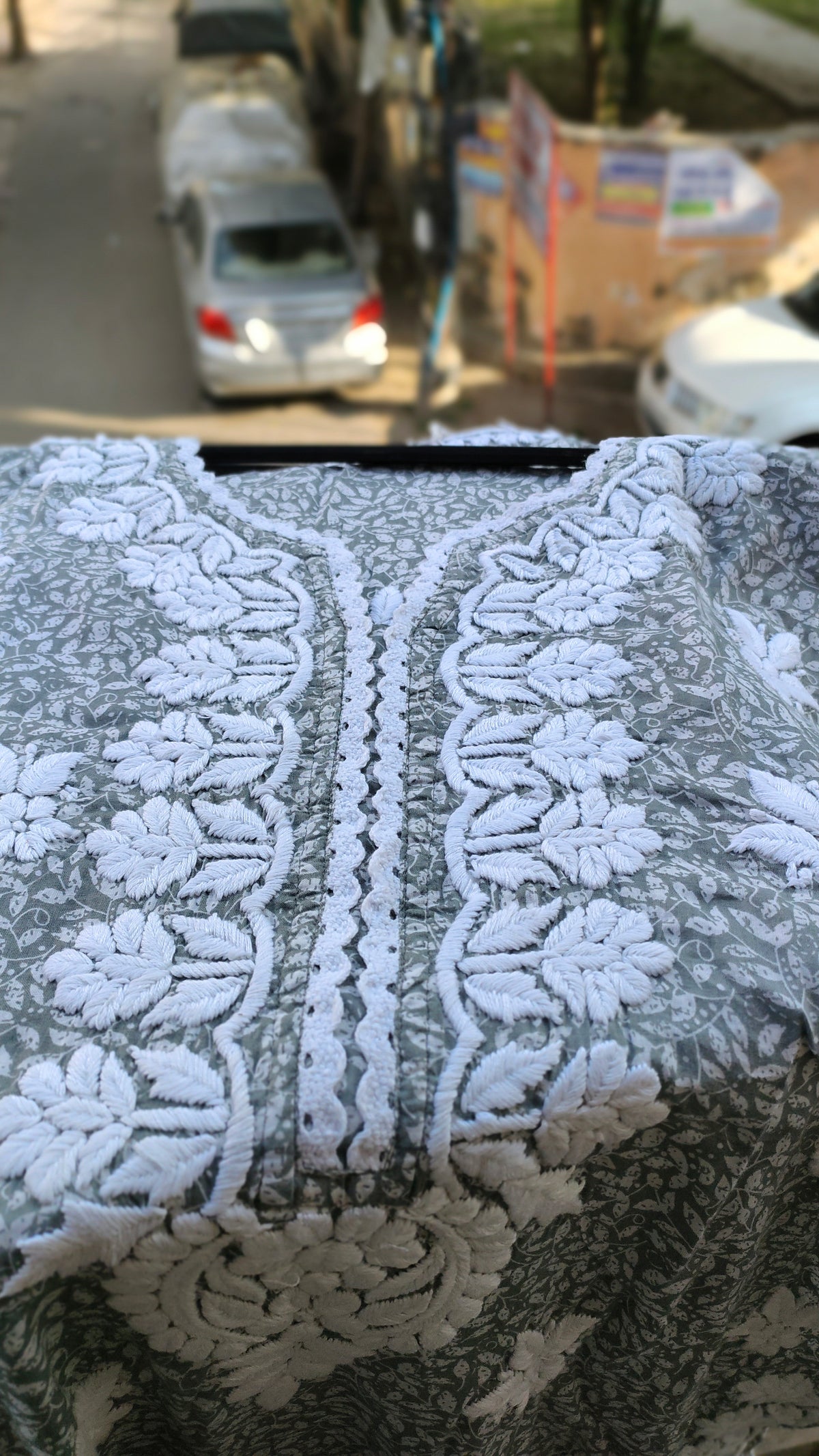 Green LVW Fashions wrist cut premium mul soft cotton kurti with handmade Lucknow Chikankari embroidery, showcasing intricate needlework.