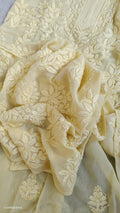 A pastel yellow georgette chikankari kurta with intricate white embroidery, handmade in Lucknow by LVW Fashions.