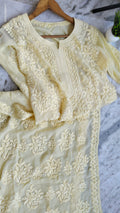 A pastel yellow georgette chikankari kurta with intricate white embroidery, handmade by LVW Fashions in Lucknow.