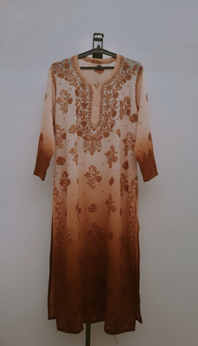 A white Adaya premium georgette long kurta with intricate Lucknow chikankari embroidery, featuring a neckline and daman details.