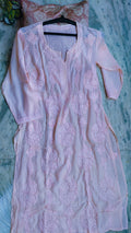 Baby pink silk long kurta with intricate white Lucknow chikankari embroidery by LVW Fashions, featuring lotus motifs and handmade craftsmanship.