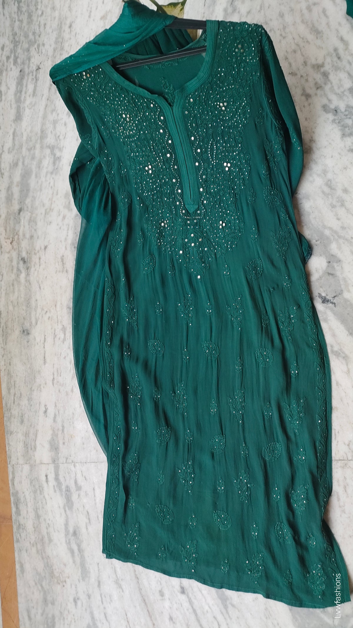 Bottle green premium georgette Chikankari sharara set with handmade Lucknow Chikankari kurta and matching sharara.