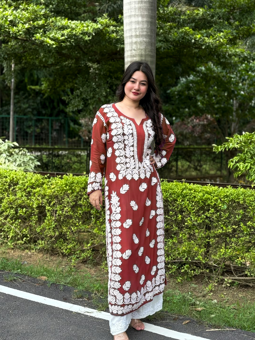 Luxurious brown Georgette long Kurti with intricate handmade Chikankari embroidery for women, featuring traditional Lucknow craftsmanship.