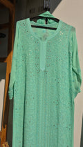Green Sheen premium georgette Gharara set with intricate handmade Lucknow Chikankari kurta by LVW Fashions.