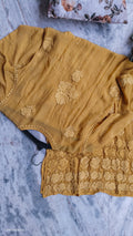 Handmade Hania Turmaric premium silk Chikankari kurta with heavy daman detailing from LVW Fashions, showcasing intricate Lucknow embroidery.