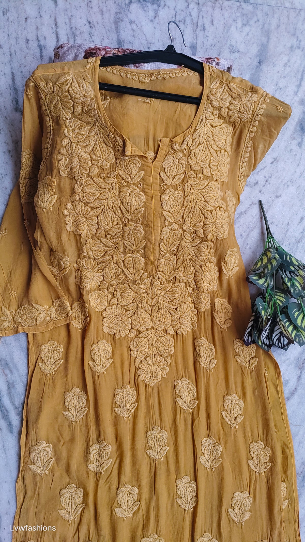 Handmade Hania Turmaric premium silk Chikankari kurta with heavy daman detailing from LVW Fashions, featuring traditional Lucknow embroidery.