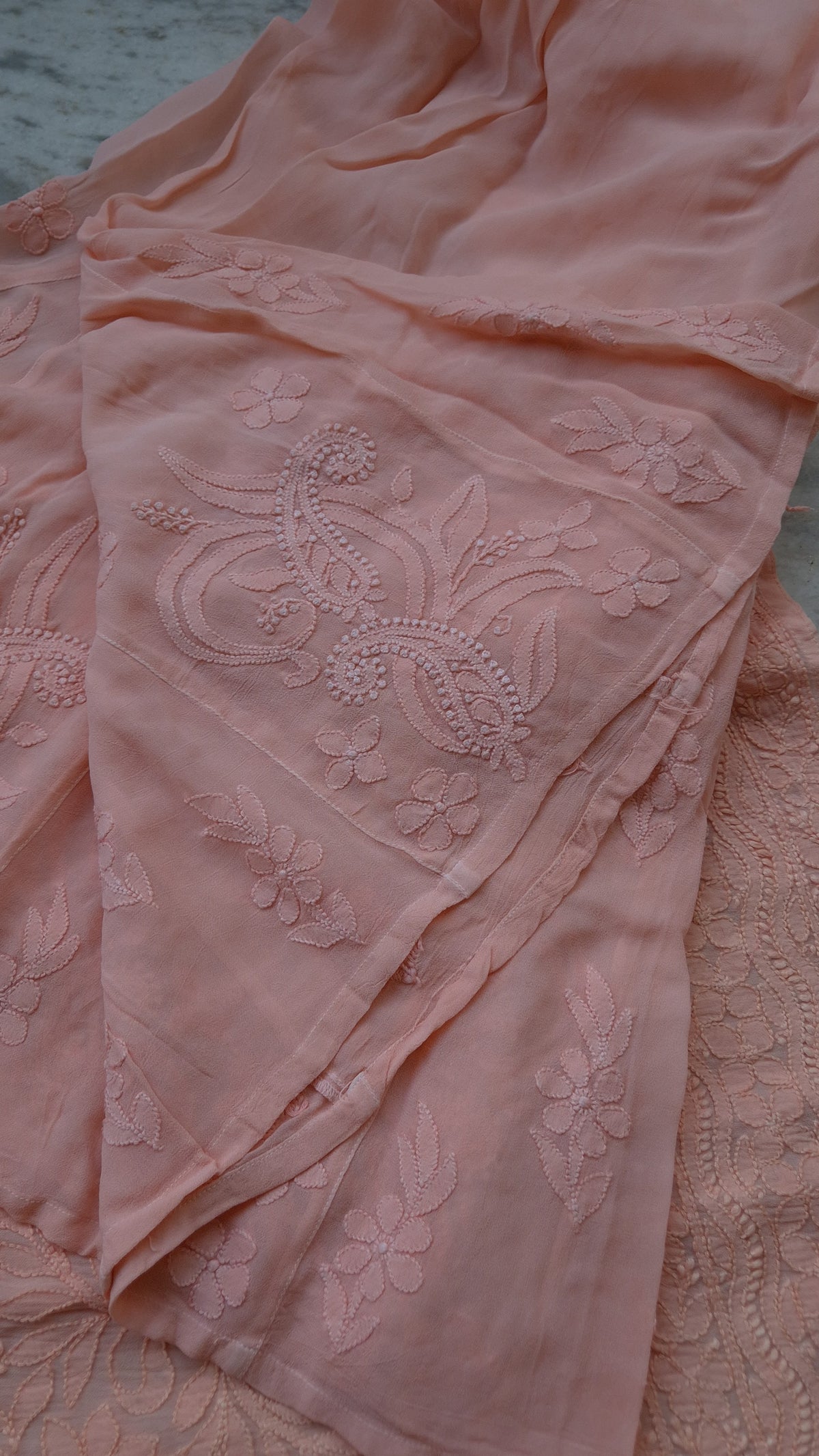 Loveable peach georgette sharara kurti set with intricate handmade Lucknow chikankari by LVW Fashions, includes kurta and sharara.