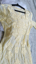 Luxurious pastel yellow silk Kurta with intricate Lucknow Chikankari embroidery by LVW Fashions, handmade and elegant.