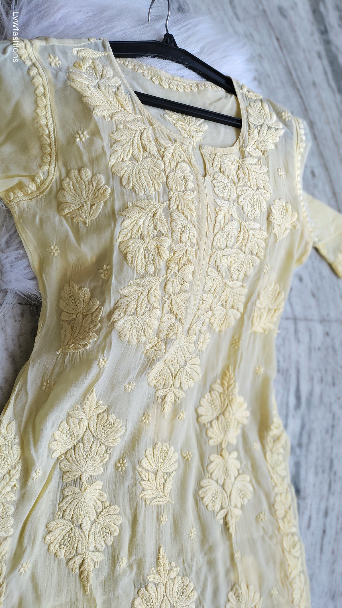 Luxurious pastel yellow silk Kurta with intricate Lucknow Chikankari embroidery by LVW Fashions, handmade and elegant.