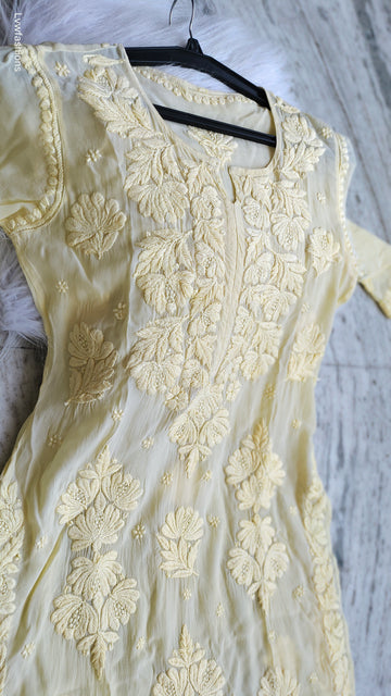 Luxurious pastel yellow silk Kurta with intricate Lucknow Chikankari embroidery by LVW Fashions, handmade and elegant.