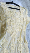 Pastel yellow silk Kurta with intricate Lucknow Chikankari embroidery by LVW Fashions, luxurious handmade Noorani design.