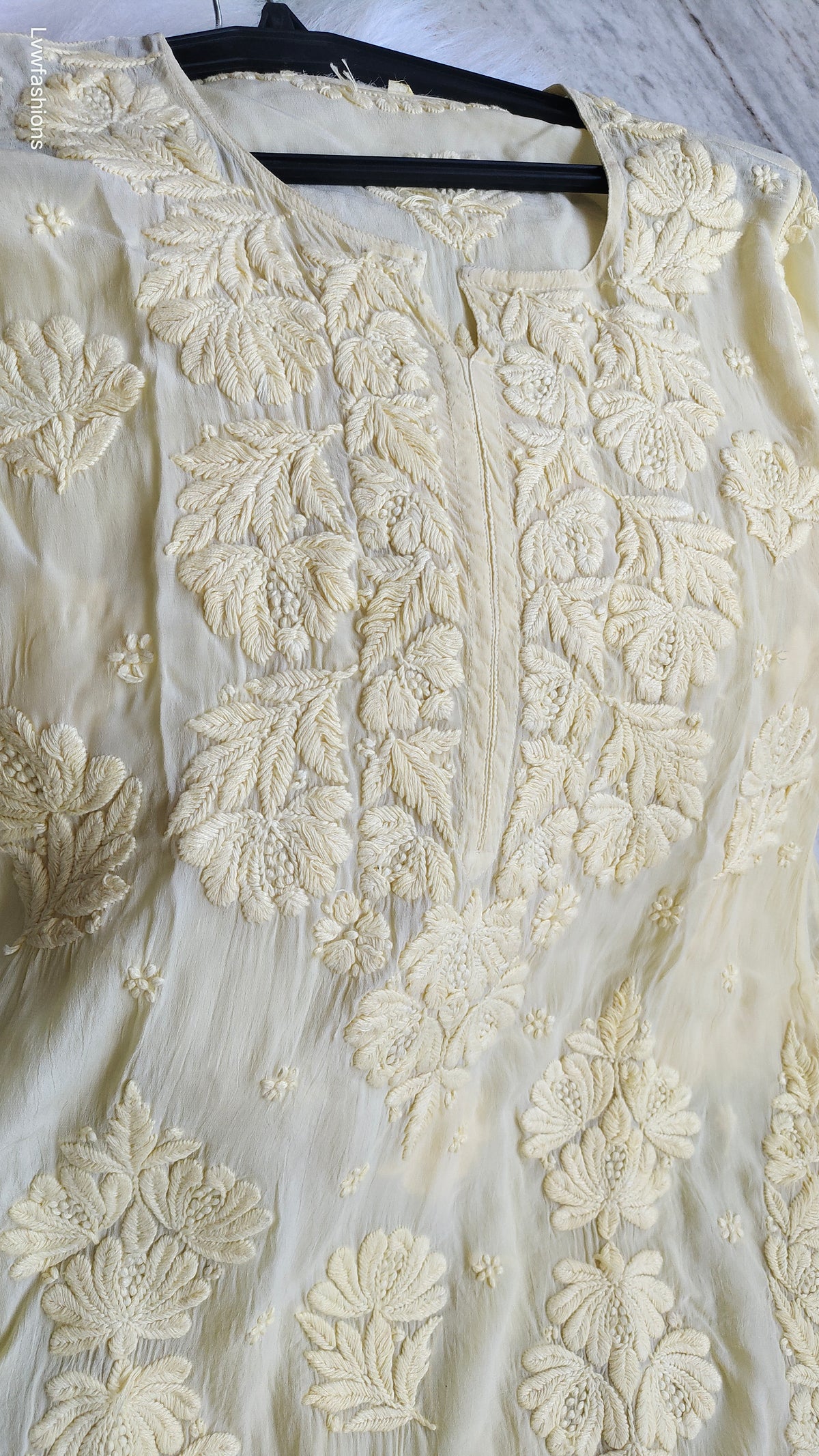 Pastel yellow silk chikankari kurta by LVW Fashions, handmade Lucknow chikankari luxurious kurta with intricate embroidery.