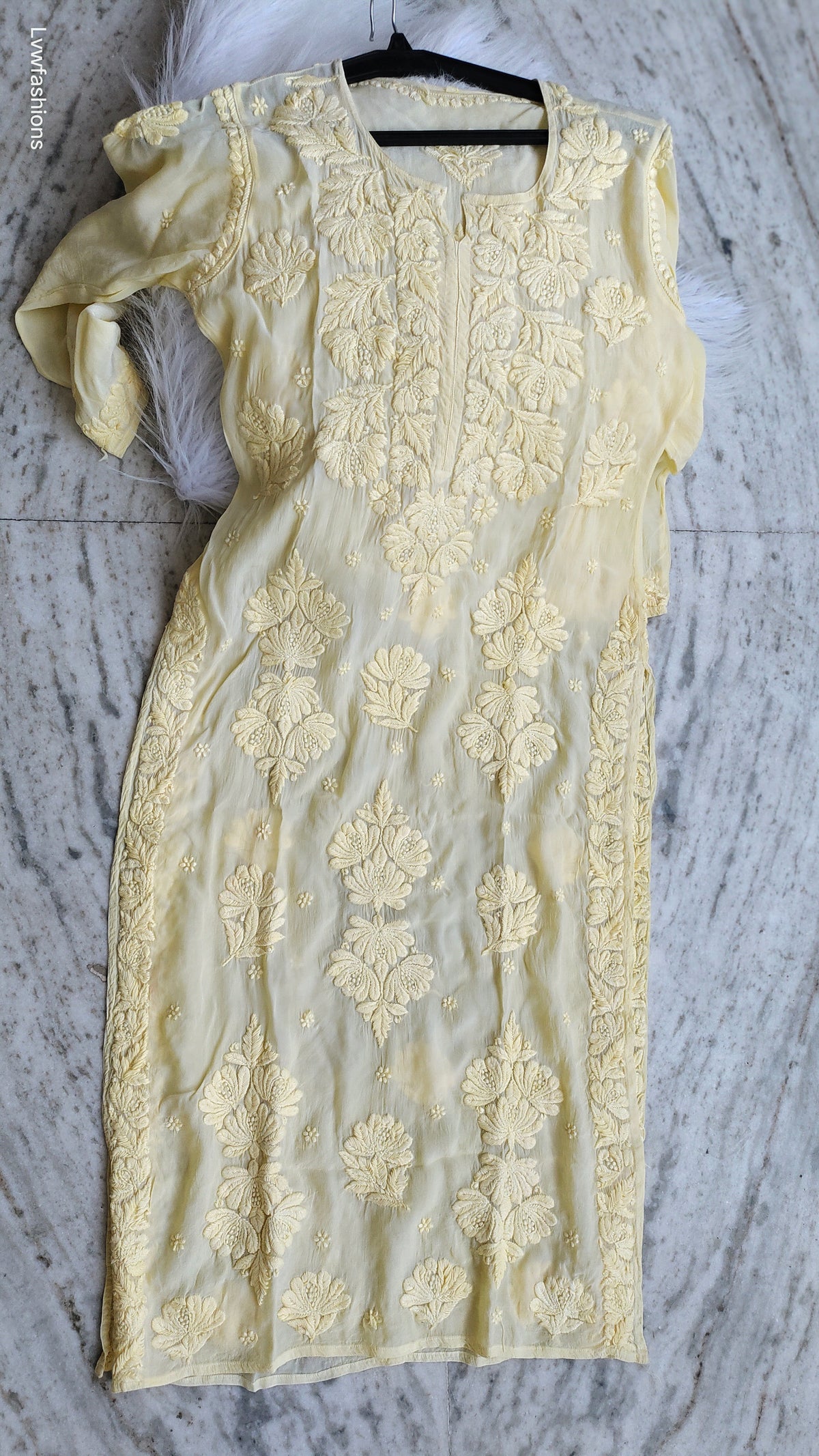 Pastel yellow silk Kurta with intricate Lucknow Chikankari embroidery by LVW Fashions, luxurious handmade Indian ethnic wear.