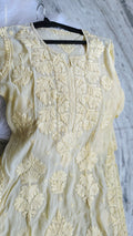 Pastel yellow silk Chikankari kurta by LVW Fashions with intricate handmade Lucknow embroidery, luxurious and elegant.