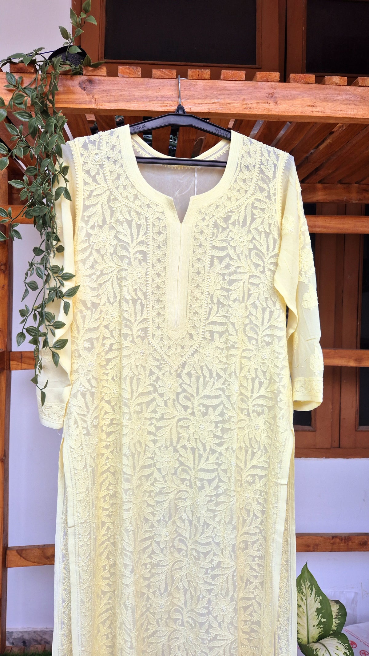 Pearl yellow premium georgette long kurti with intricate handmade Lucknow chikankari embroidery by LVW Fashions.