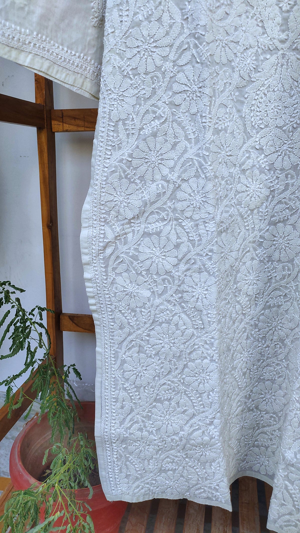Ivory cotton long kurta with intricate hand-chikankari embroidery from LVW Fashions, made with premium voil cotton fabric.