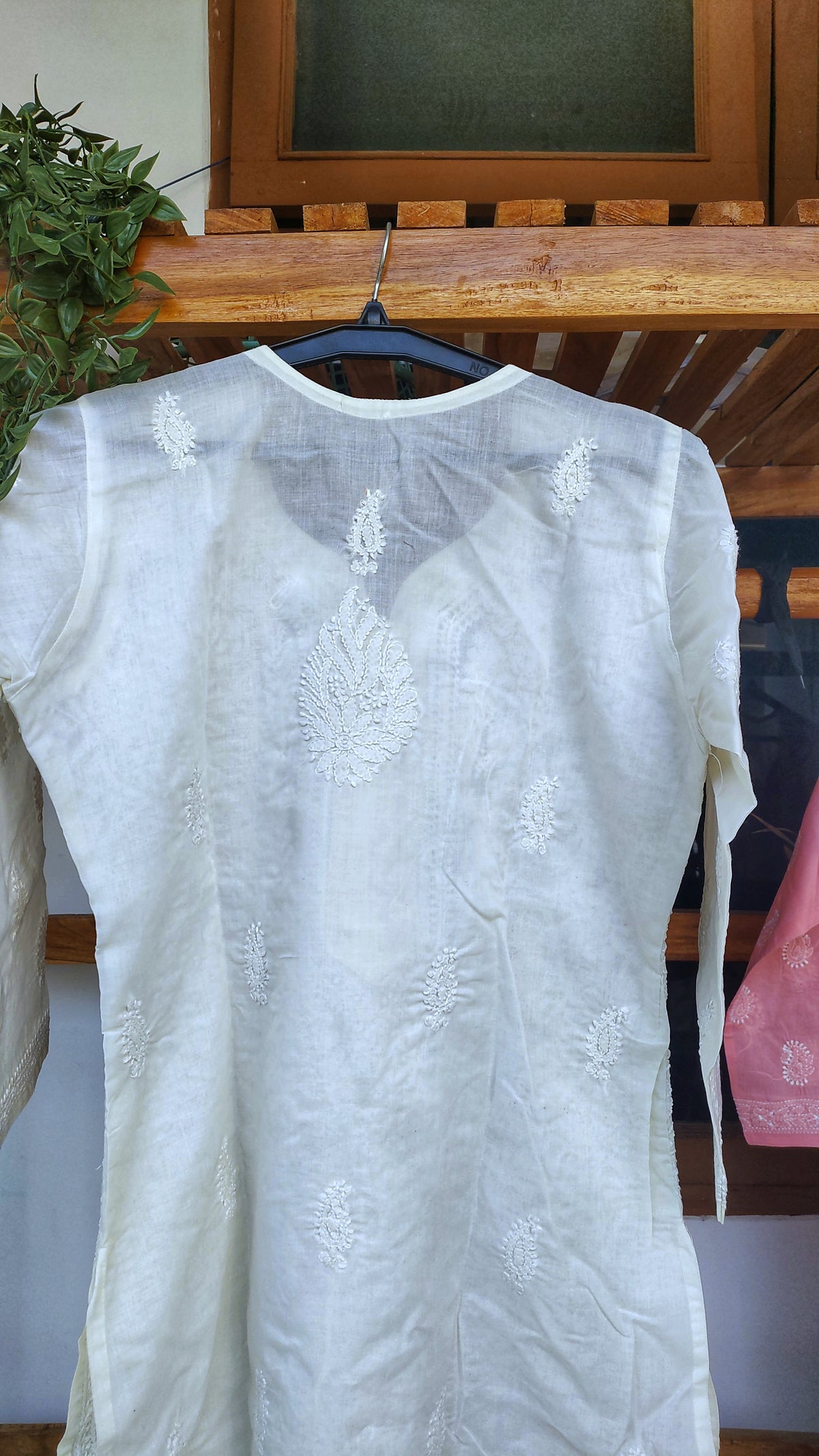 Ivory long kurta made of premium voil cotton with intricate Lucknow chikankari embroidery by LVW Fashions.