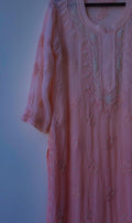 Soft peach Noori Pearls Lucknow Chikankari kurta with premium georgette, hand-embroidered cutdana, and intricate chikankari details.