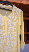 Sunshine yellow silk chikankari long kurti with mukaish detailing, handmade by LVW Fashions, showcasing intricate Lucknow embroidery.