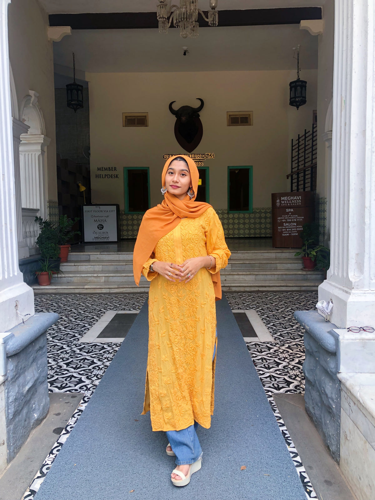 Luxurious turmeric-colored georgette long kurti with intricate hand-embroidered chikankari from LVW Fashions.