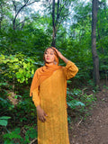 Luxurious turmeric Georgette long kurti with intricate hand-embroidered Chikankari from LVW Fashions, showcasing traditional Lucknow craftsmanship.