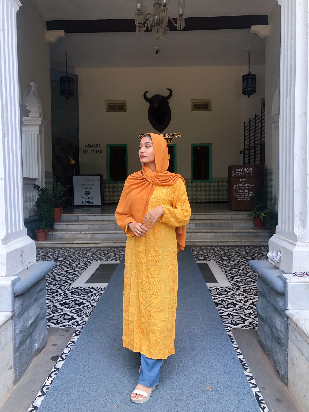 Luxury turmeric-colored Georgette long kurti with intricate hand-embroidered Chikankari by LVW Fashions, showcasing traditional Lucknow craftsmanship.