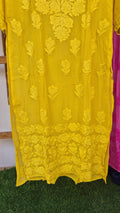 Turmeric yellow premium silk long kurta with intricate handmade Lucknow chikankari embroidery by LVW Fashions.