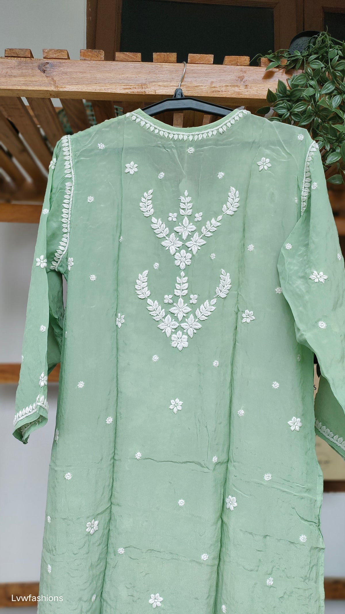 Pista green Zeba premium silk long kurti with intricate handmade Lucknow chikankari embroidery by LVW Fashions.