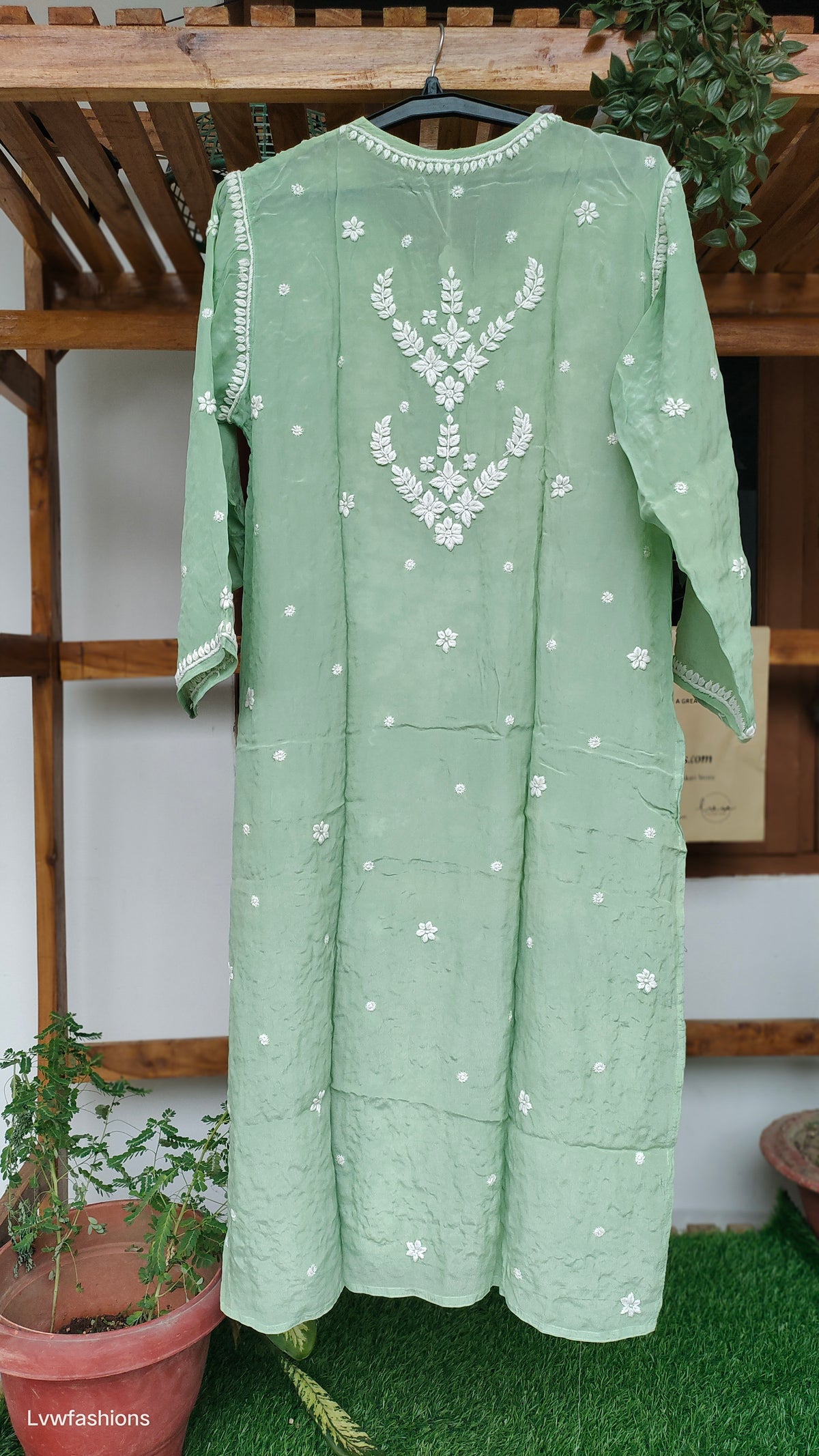 Pista green luxury silk long kurti with intricate handmade Chikankari embroidery from LVW Fashions, showcasing traditional Lucknow craftsmanship.