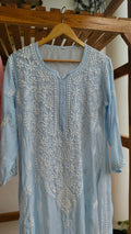 Pinkish peach Fizza muslin silk Chikankari kurta by LVW Fashions with intricate handmade Lucknow embroidery.