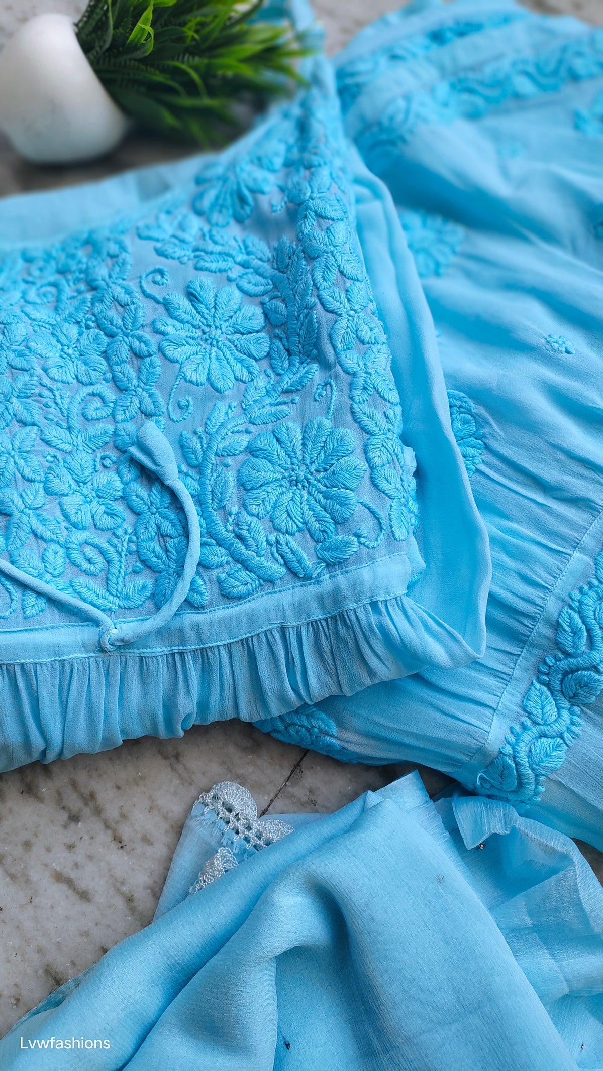 Handmade Tulip Tunic with intricate Lucknow Chikankari paired with luxurious Gharara from LVW Fashions.