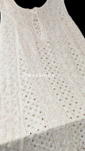 Beautiful white sleeveless A-line Anarkali dress with luxurious look and Chikankari embroidery, 50-inch length by LVW Fashion Luxurious.