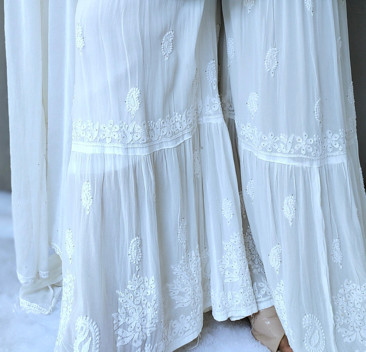 Luxurious LVW Fashion georgette Gharara set with intricate Kamdani embroidery and attached lining, showcasing elegant traditional Chikankari style.